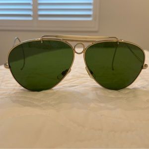 Rayban sunglasses with gold frame and green lenses. Measures about 5.5 inches